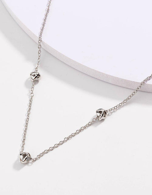 Load image into Gallery viewer, Gold Love Knot Necklace by Hollywood Sensation®
