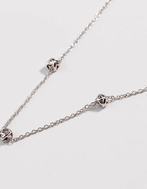 Load image into Gallery viewer, Gold Love Knot Necklace by Hollywood Sensation®
