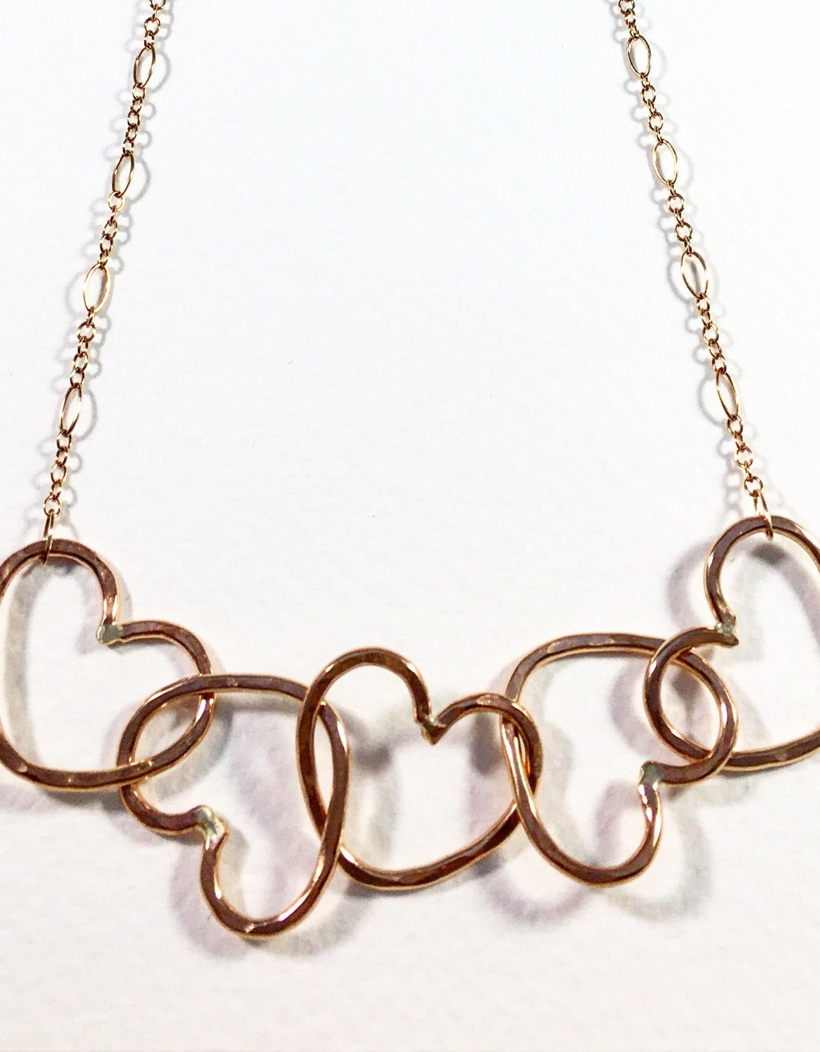 Five Hearts Linked Necklace by Jennifer Cervelli Jewelry