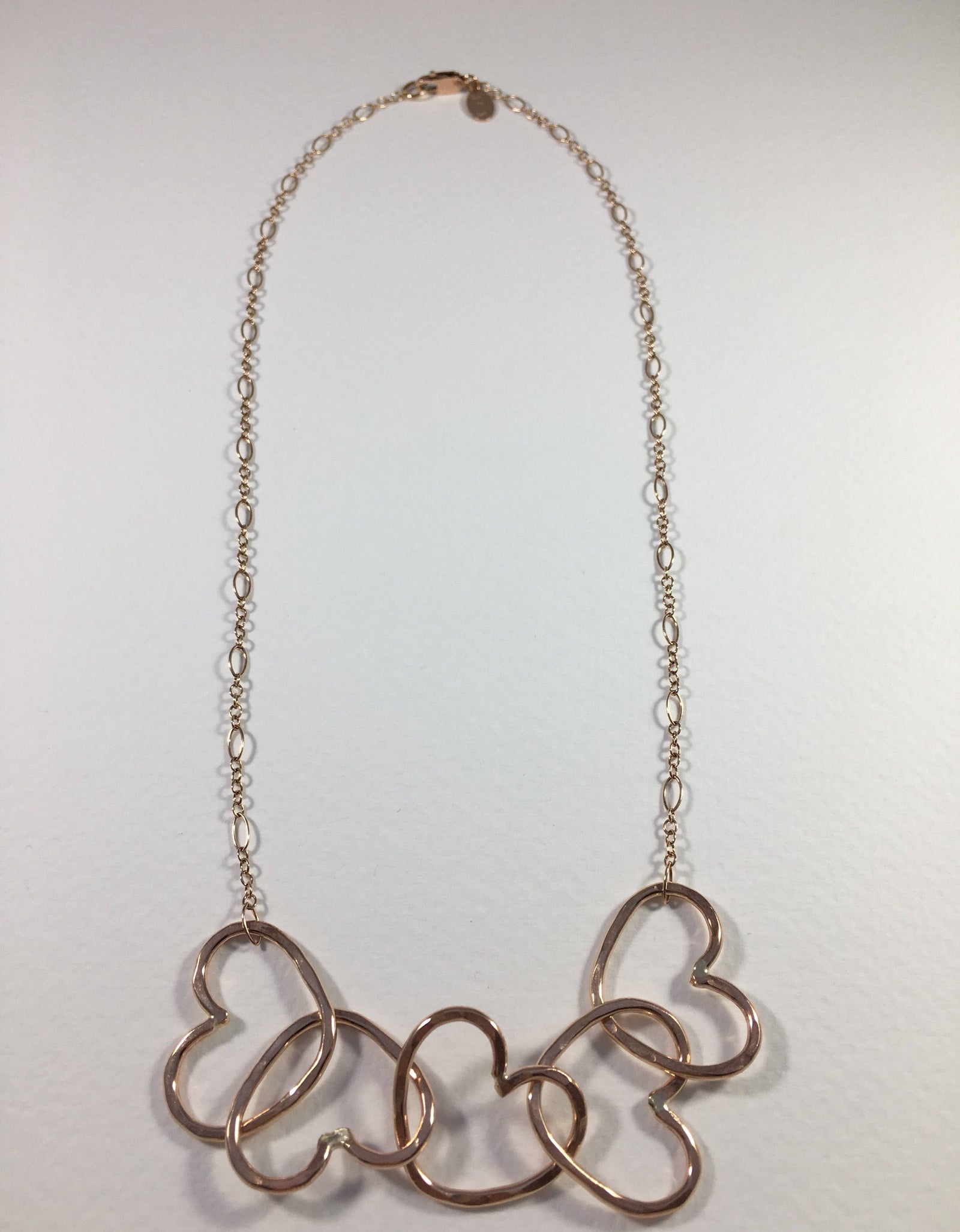 Five Hearts Linked Necklace by Jennifer Cervelli Jewelry