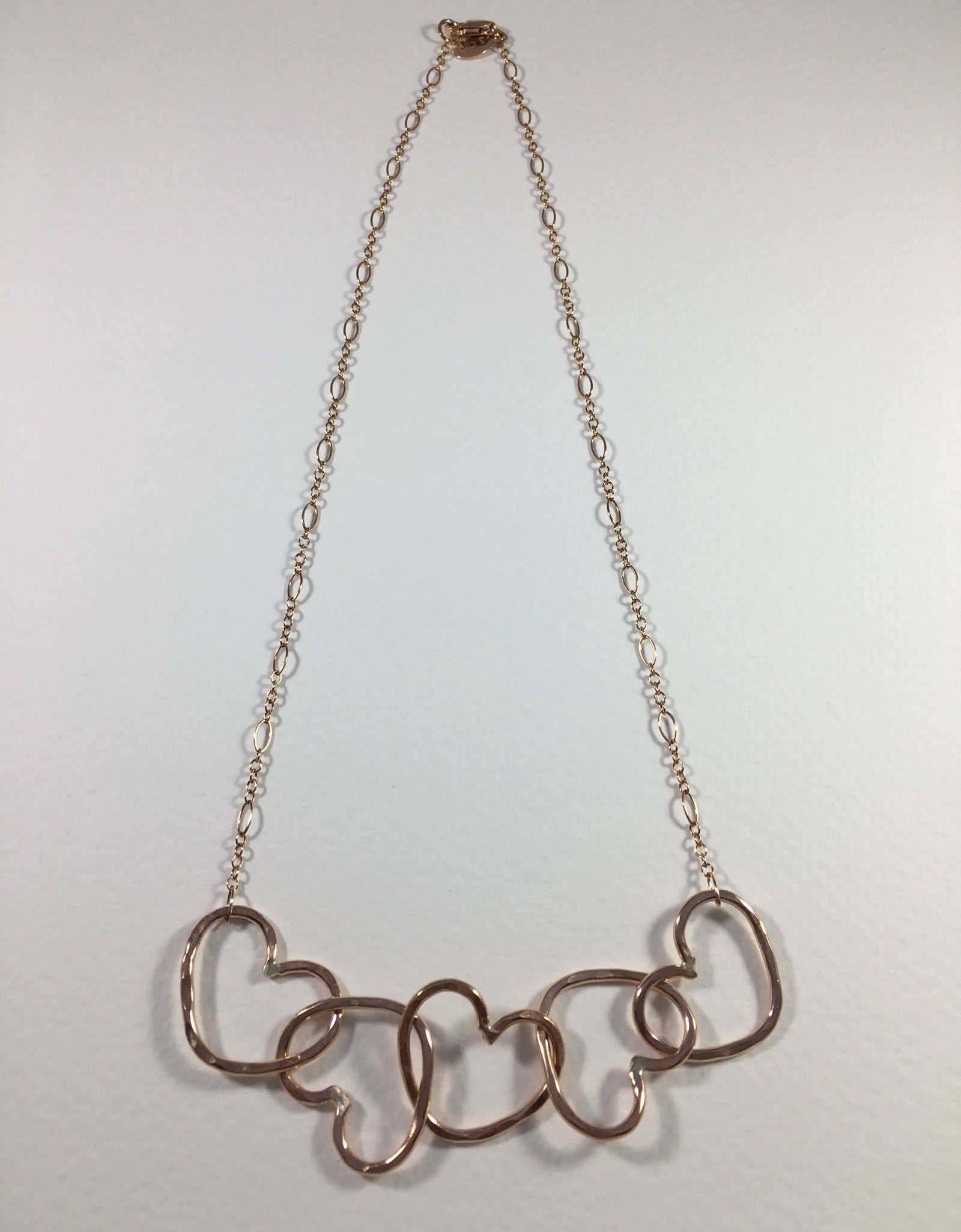 Five Hearts Linked Necklace by Jennifer Cervelli Jewelry