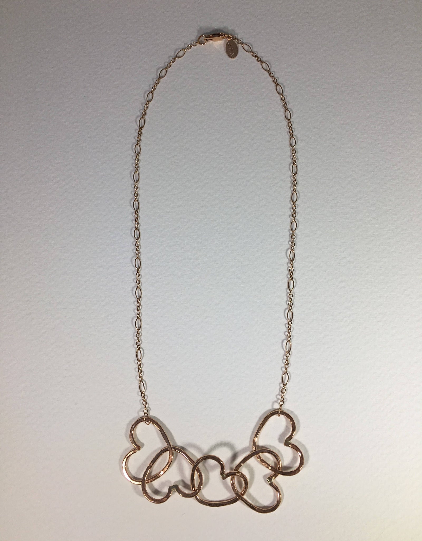 Five Hearts Linked Necklace by Jennifer Cervelli Jewelry