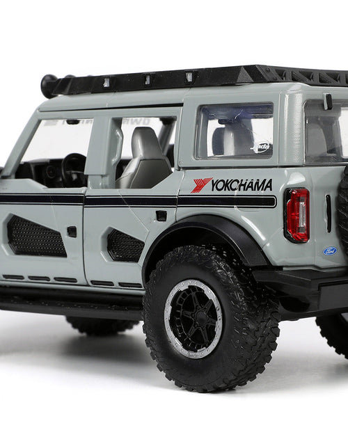 Load image into Gallery viewer, 2021 Ford Bronco Gray with Black Stripes with Roof Rack "Own the Night" "Just Trucks" Series 1/24 Diecast Model Car by Jada
