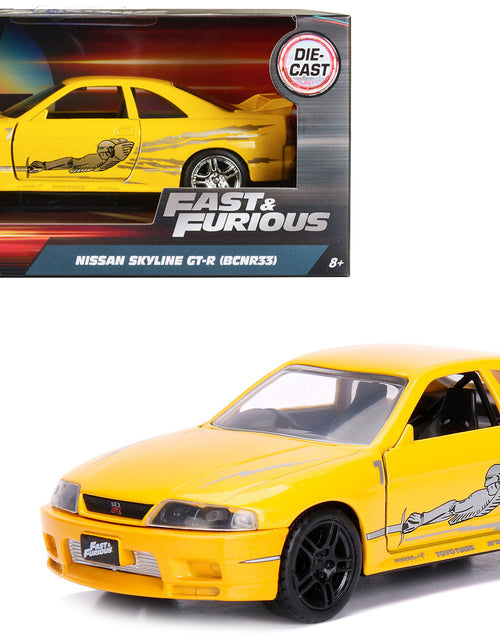 Load image into Gallery viewer, Leon's Nissan Skyline GT-R (BCNR33) Yellow Metallic with Graphics "Fast &amp; Furious" Series 1/32 Diecast Model Car by Jada
