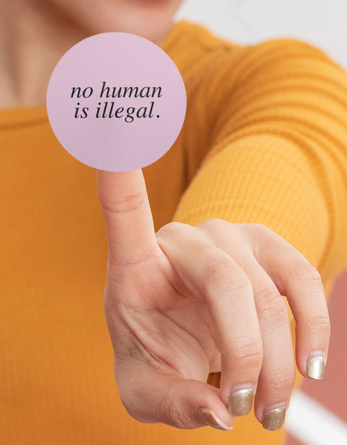 Load image into Gallery viewer, No Human Is Illegal | We Welcome Sticker by The Happy Givers
